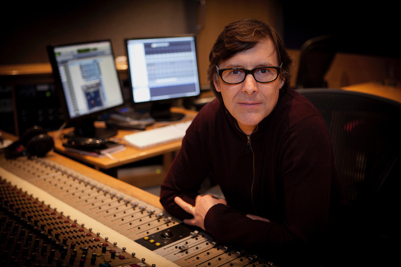 UCA PhD student and composer Mike McEvoy sitting at a mixing desk