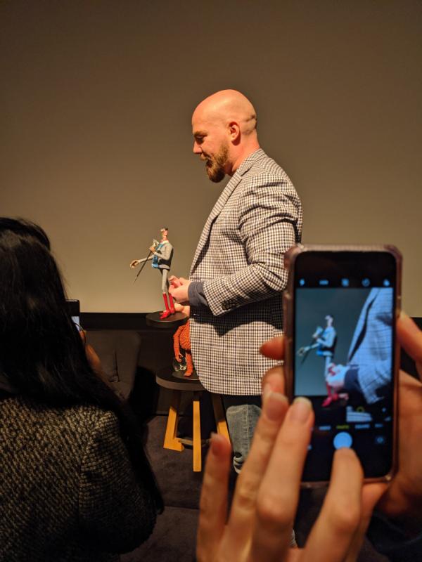 Chris Butler demonstrating one of the puppets to students. Picture by Daniel Aguirre Hansell